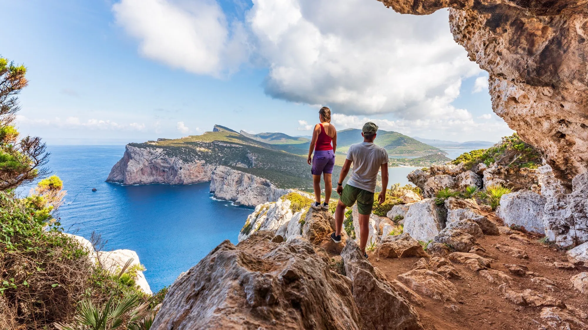 Couple taking in a Sardinian coastal panorama