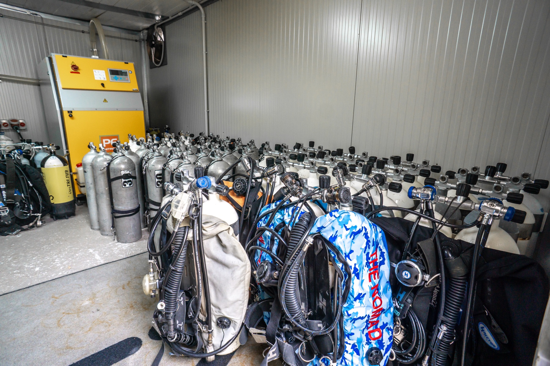 Tank storage room with compressor and dive gear