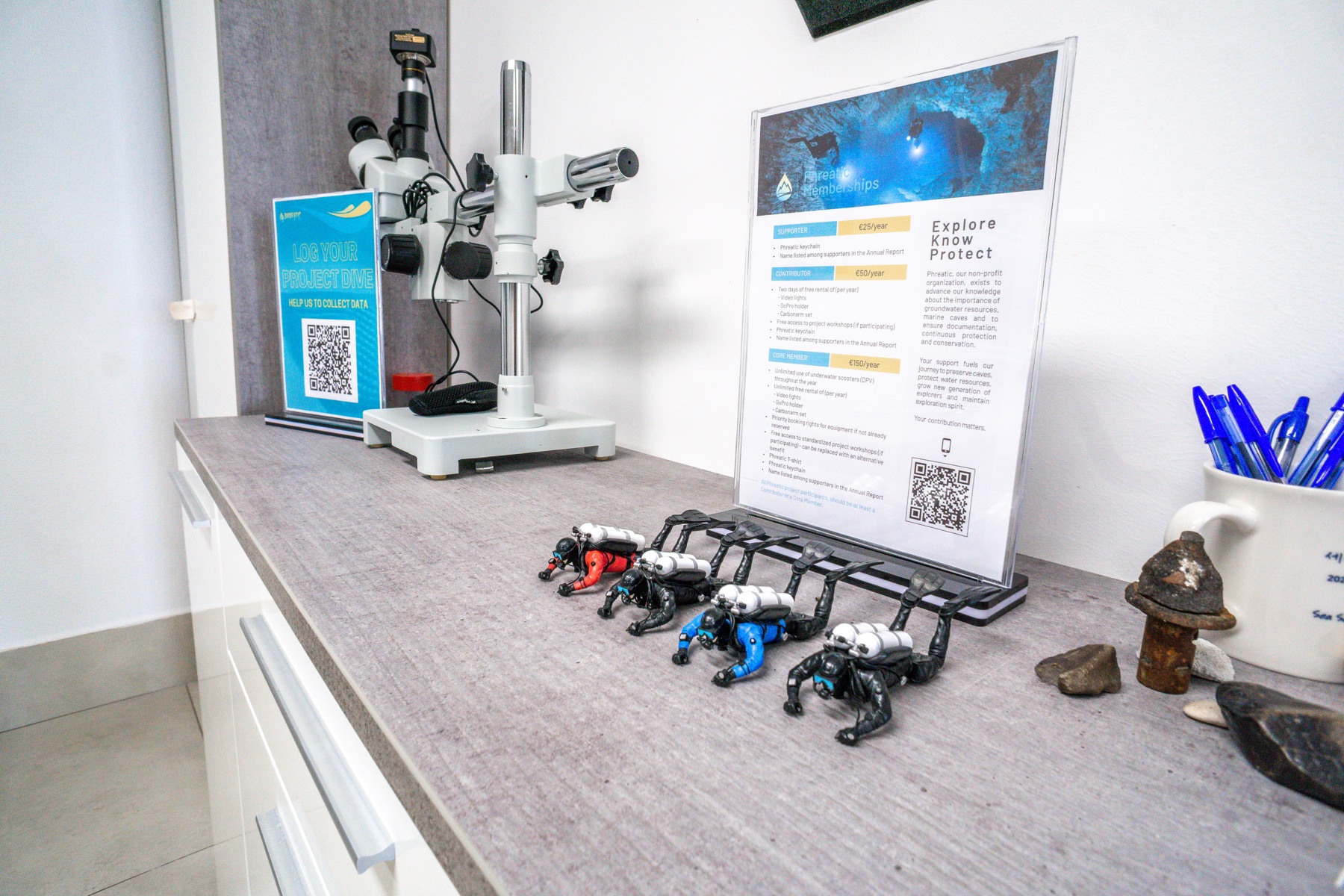Research bench with microscope and underwater robots