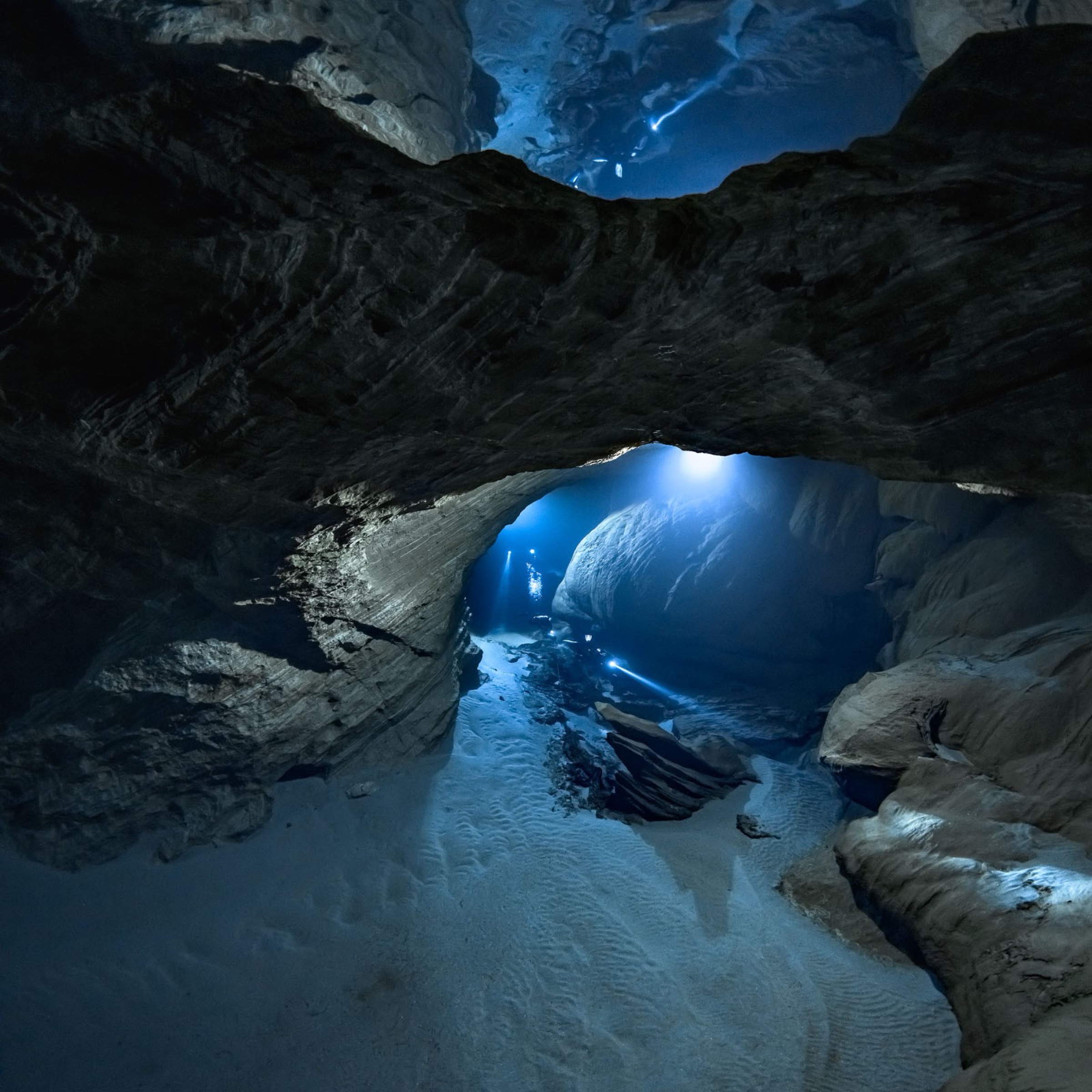 Atmospheric cave arch with blue glow